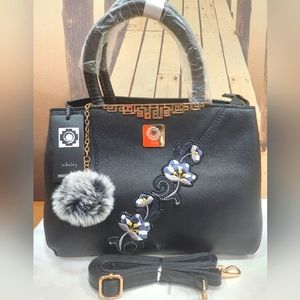 Brand New Leather Woman Shoulder bag with flower design.